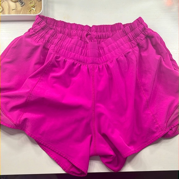 lululemon athletica Pants - lululemon sonic pink hotty hot shorts, 4 inch low rise, size 10